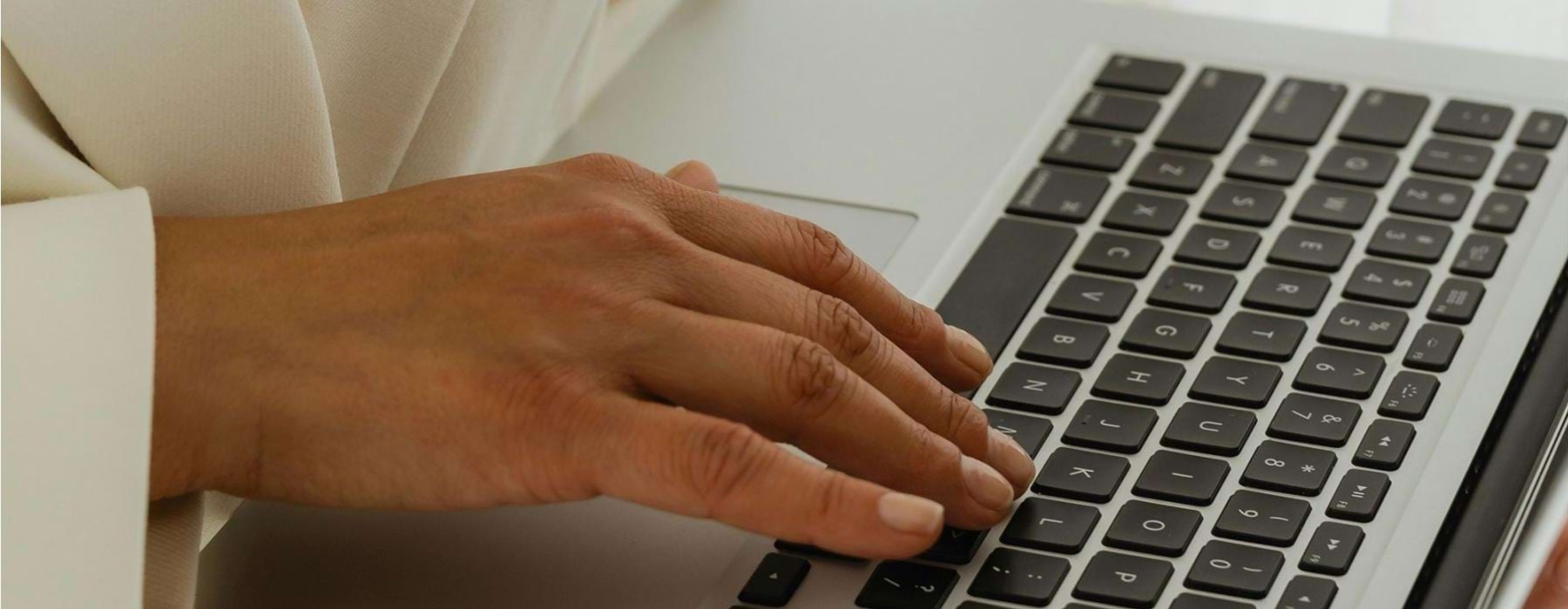 a person typing on a laptop