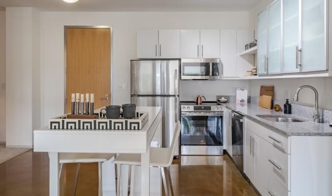 a kitchen with white cabinets